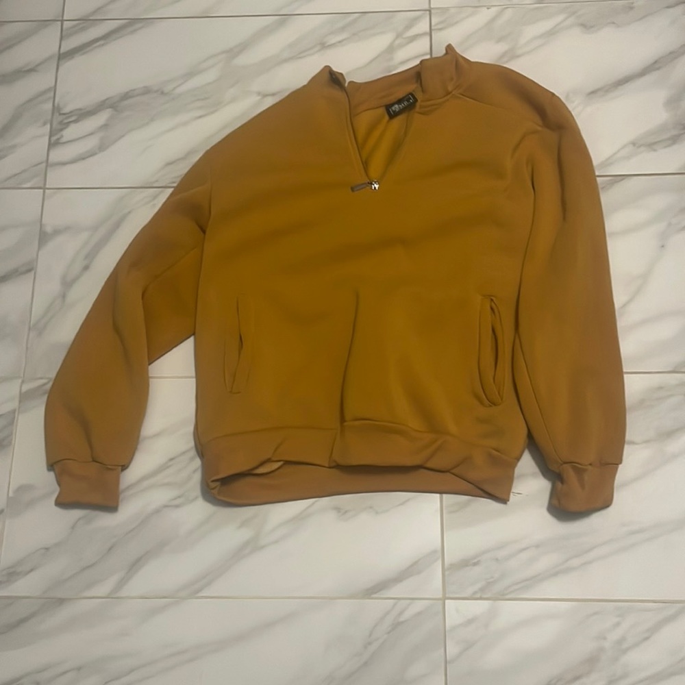a yellow sweatshirt